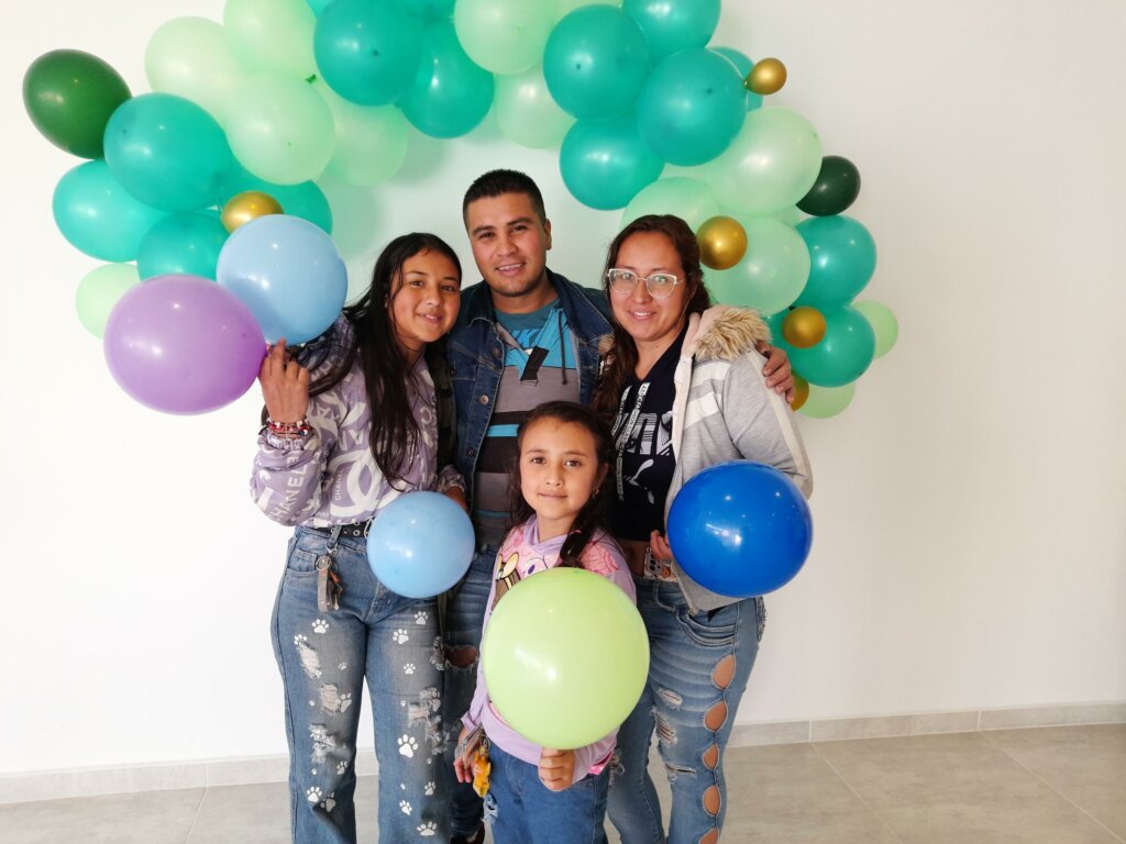 family in Colombia celebrating provisions through sponsorship program