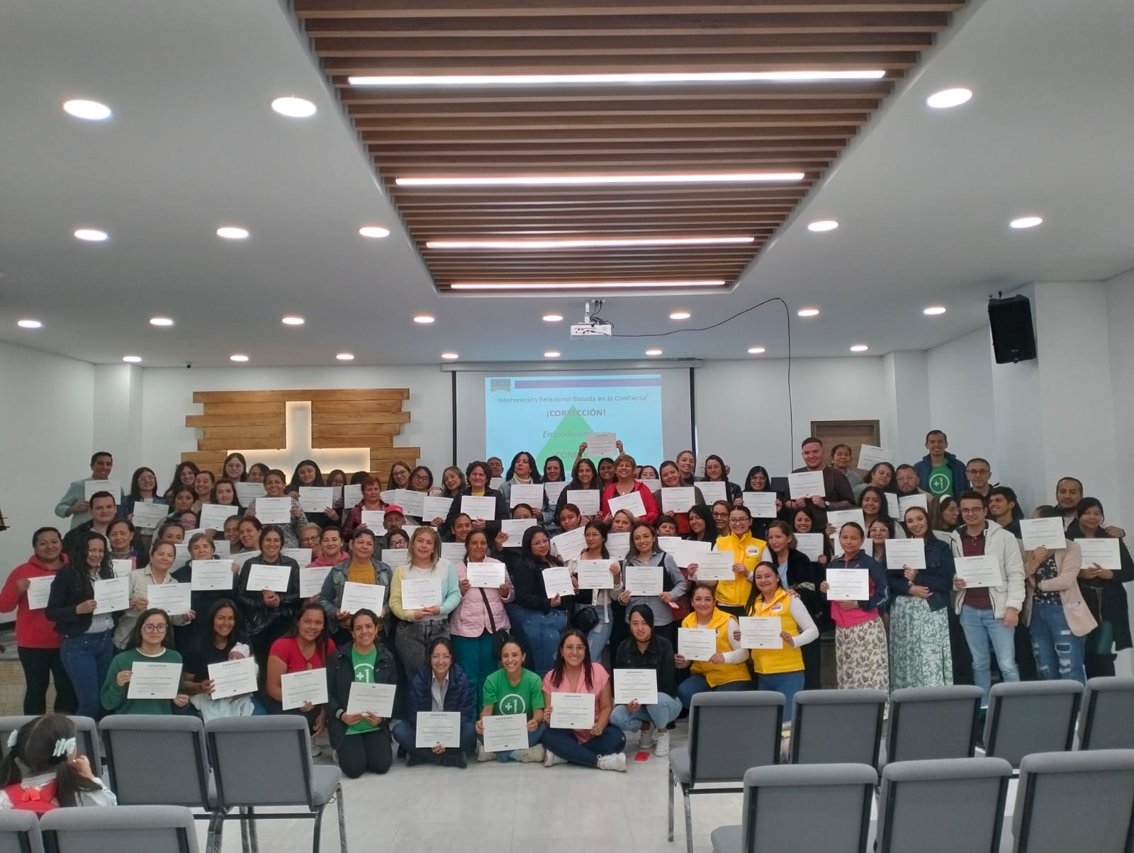 group of trainees holding their certificate in colombia
