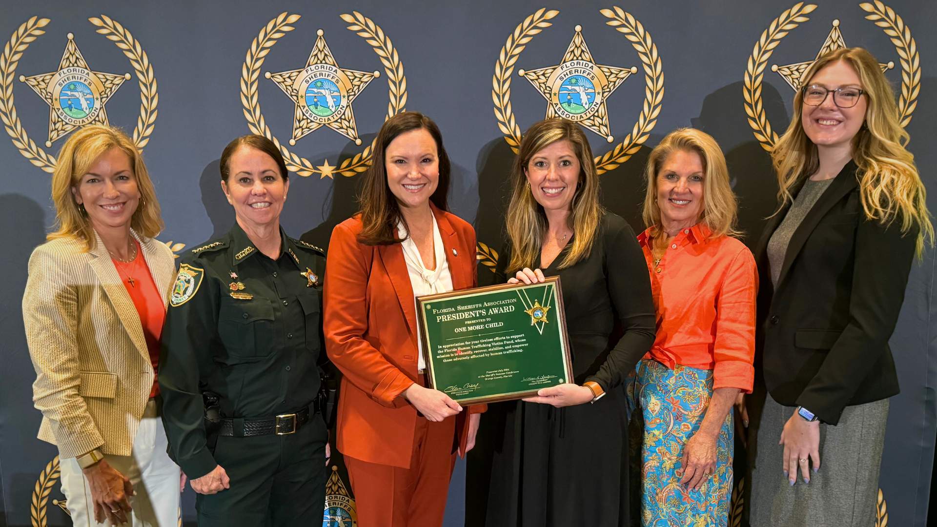 Jodi Domangue, One More Child Vice President of Program Operations and Public Policy at One More Child, receives President’s Award from the Florida Sheriffs Association.